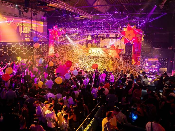 Colourful balloons and confetti above the packed dance floor at an EPICO party