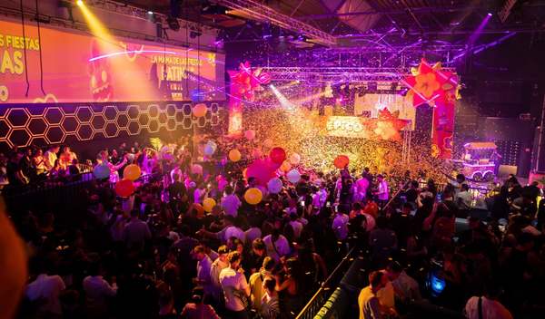 Colourful balloons and confetti above the packed dance floor at an EPICO party
