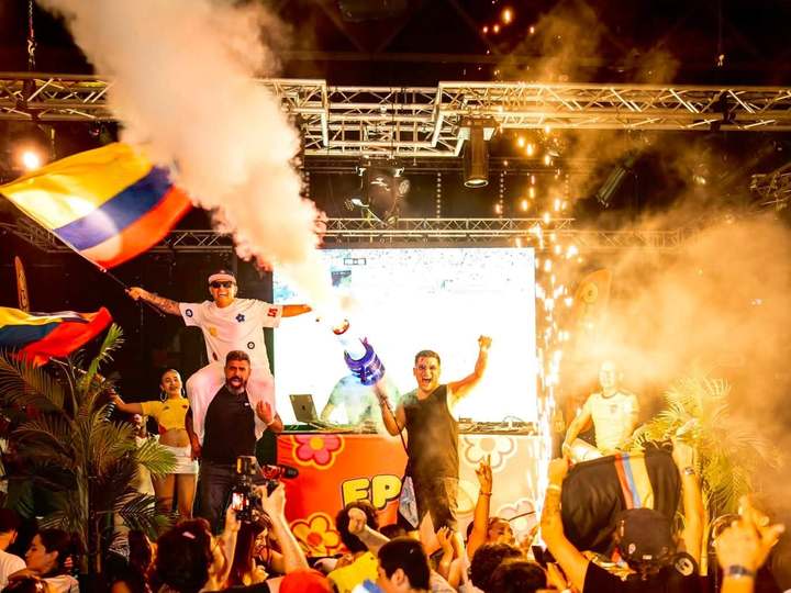 Colombian flag waved above the crowd as the CO2 smoke cannons fire on stage