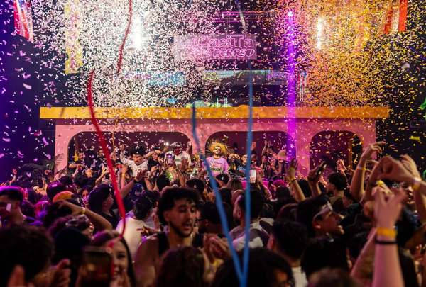Confetti explosion raining down on the crowd in front of EPICO's pink arched stage