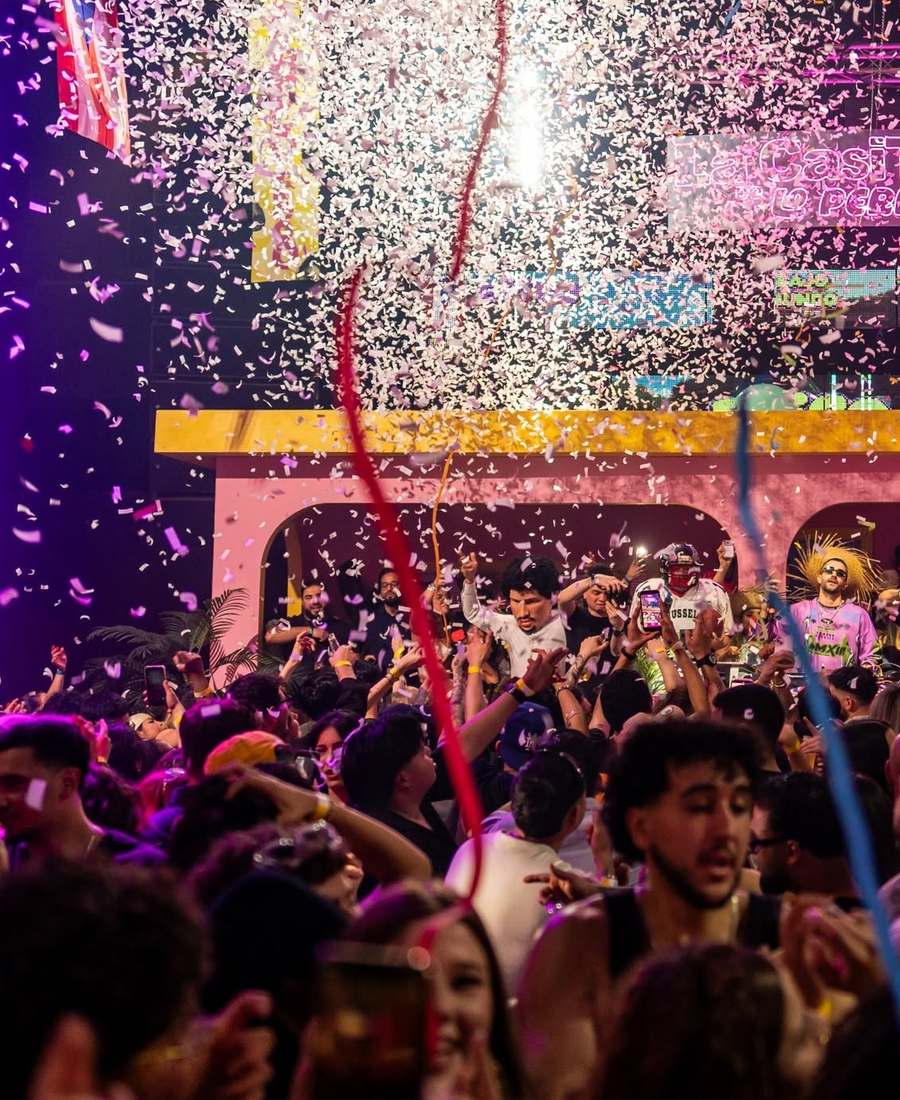 Confetti explosion raining down on the crowd in front of EPICO's pink arched stage