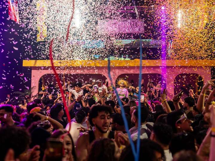 Confetti explosion raining down on the crowd in front of EPICO's pink arched stage